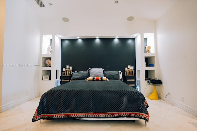 bedroom featuring tile patterned floors, visible vents, and baseboards