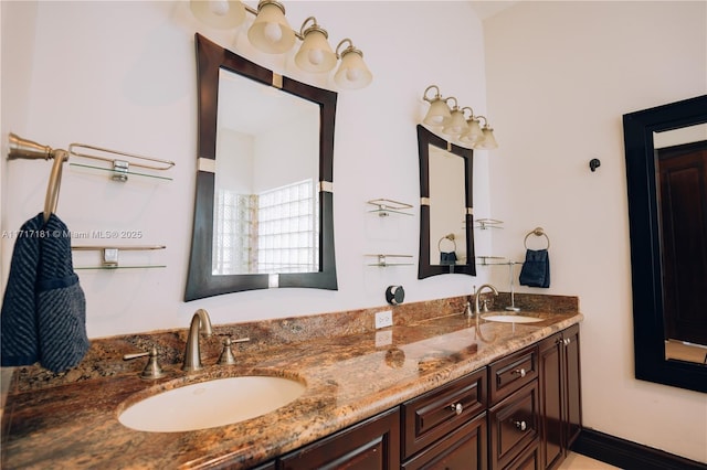 bathroom with double vanity and a sink