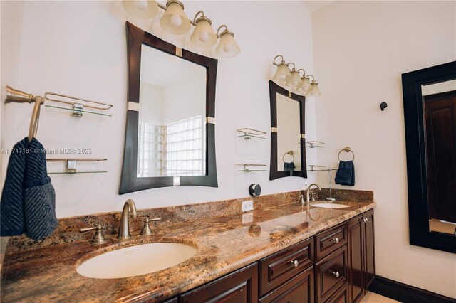 full bath with double vanity and a sink