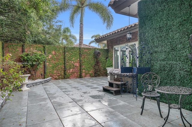 view of patio featuring fence