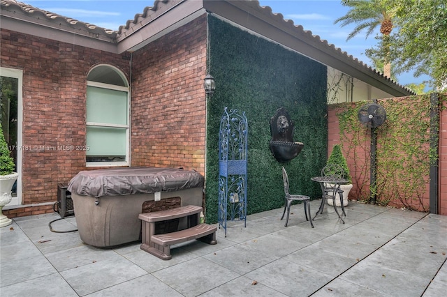 view of patio / terrace featuring a hot tub