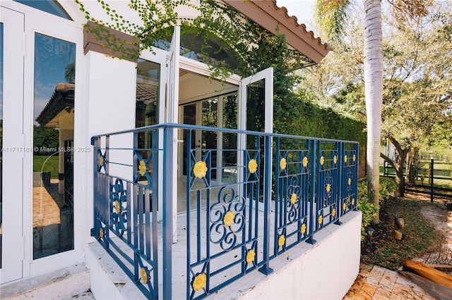 view of gate with entry steps and fence