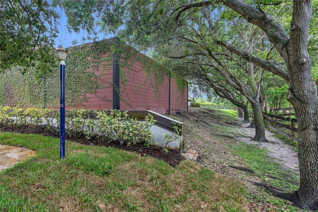 view of side of home with fence