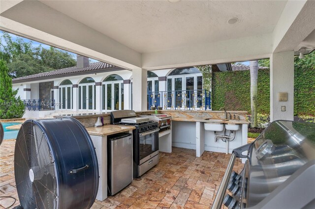 13431 Old Sheridan St, Southwest Ranches, FL 33330 - view of patio / terrace with an outdoor kitchen and a sink