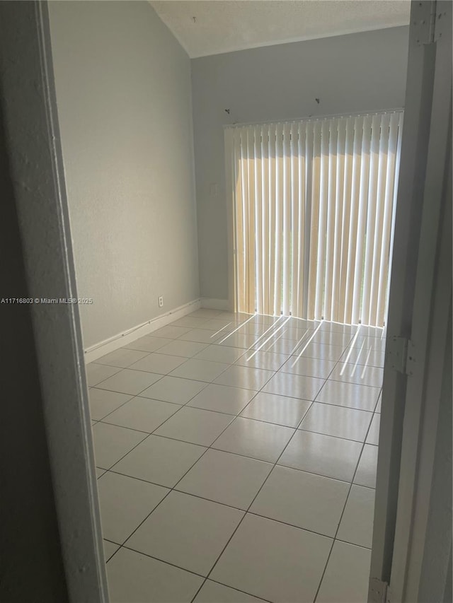 empty room with light tile patterned flooring