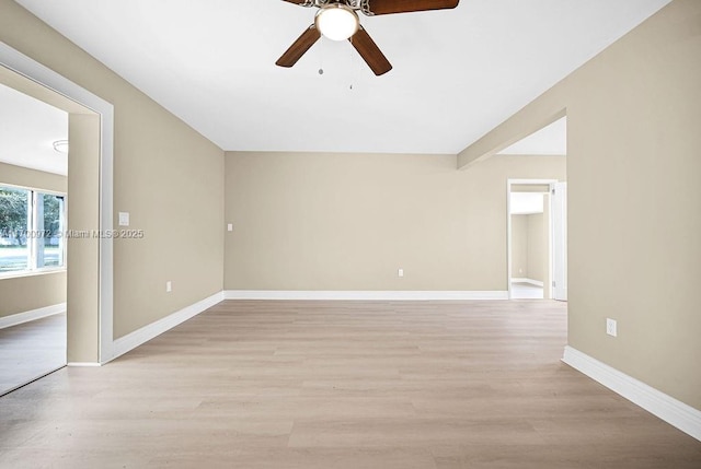 spare room featuring light hardwood / wood-style flooring and ceiling fan