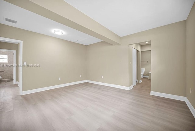 spare room with light hardwood / wood-style floors