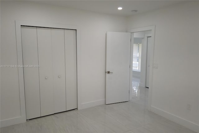 unfurnished bedroom featuring a closet