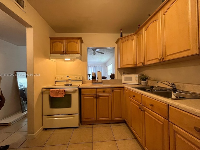 kitchen with light tile patterned floors, range with electric cooktop, ceiling fan, and sink