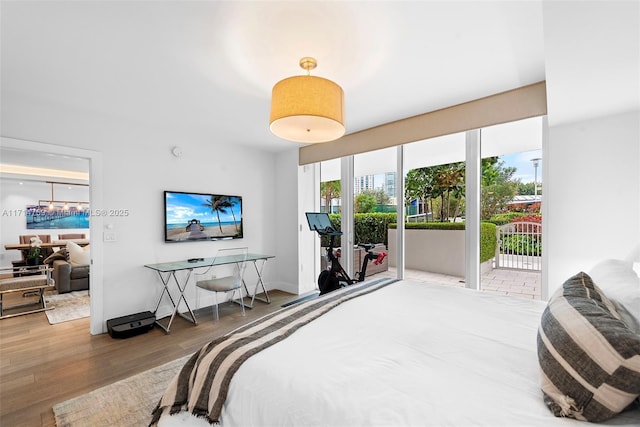 400 Alton Rd Unit 509, Miami Beach, FL 33139 - bedroom with wood finished floors and access to exterior