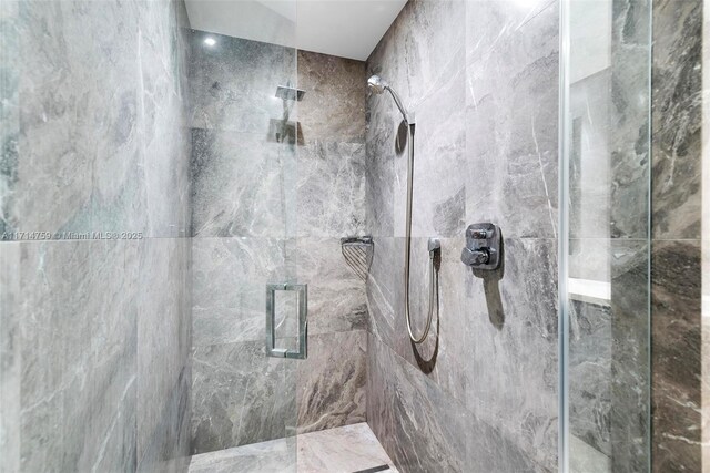 bathroom with tiled shower