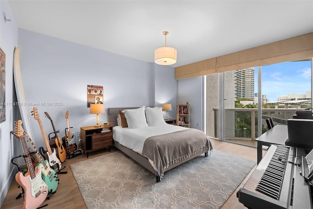 bedroom with hardwood / wood-style flooring