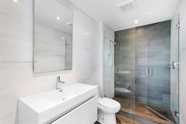 400 Alton Rd Unit 509, Miami Beach, FL 33139 - full bathroom with vanity, a stall shower, tile walls, and recessed lighting