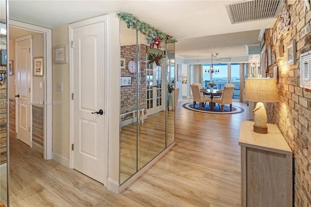 hallway with light wood-type flooring