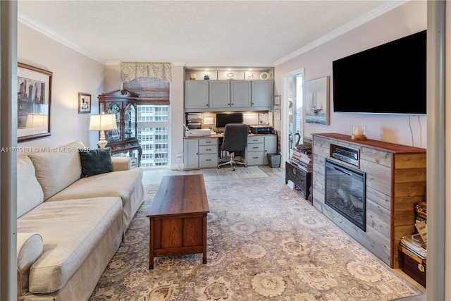 living room with crown molding, built in desk, a textured ceiling, and light wood-type flooring