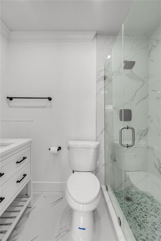 bathroom with vanity, toilet, and a shower with shower door