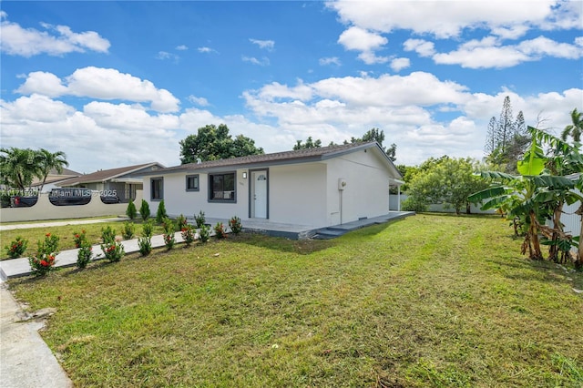 view of front of property with a front lawn