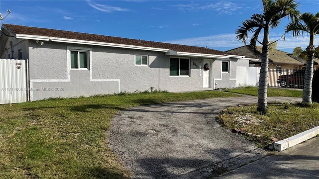 view of side of home with a lawn