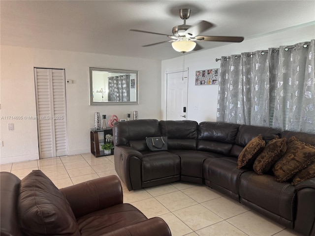 tiled living area featuring a ceiling fan