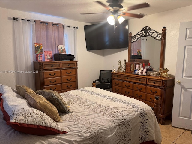 bedroom featuring a ceiling fan and light tile patterned flooring