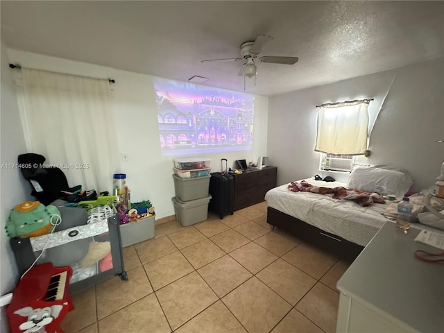 bedroom with light tile patterned floors and a ceiling fan