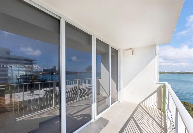 balcony featuring a water view