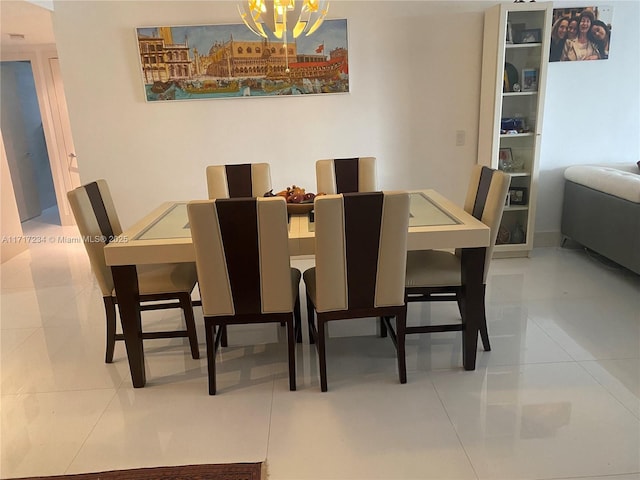 dining area with tile patterned floors and an inviting chandelier