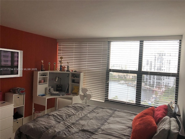 bedroom with multiple windows