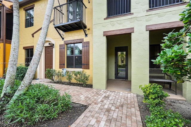 entrance to property with a balcony