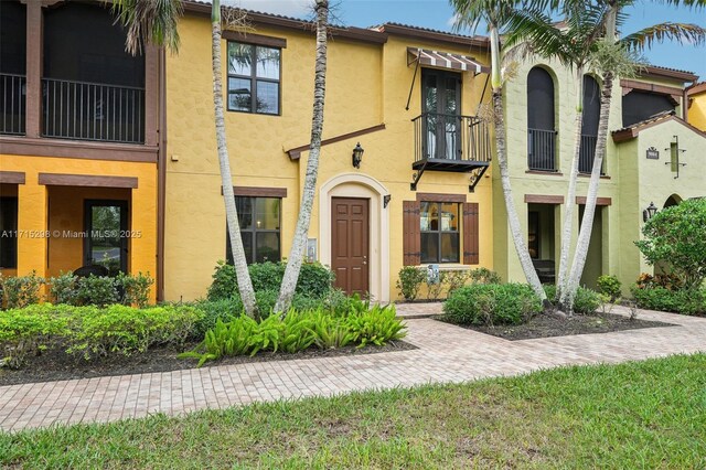 entrance to property with a balcony