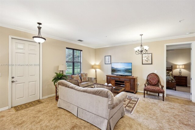 living room featuring a chandelier and crown molding