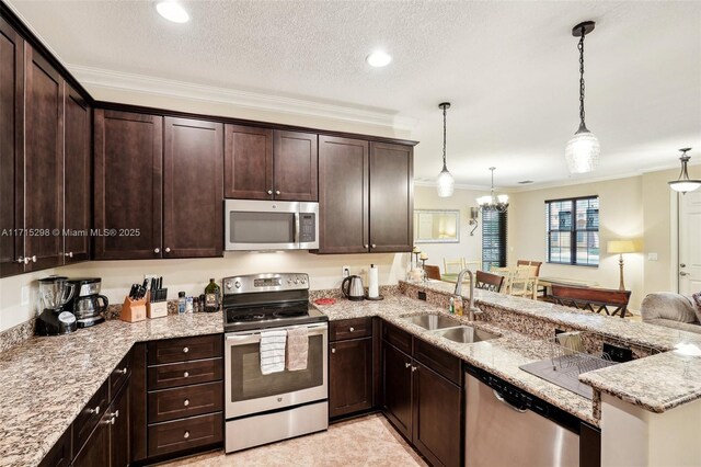 kitchen featuring sink, hanging light fixtures, dark brown cabinets, kitchen peninsula, and stainless steel appliances