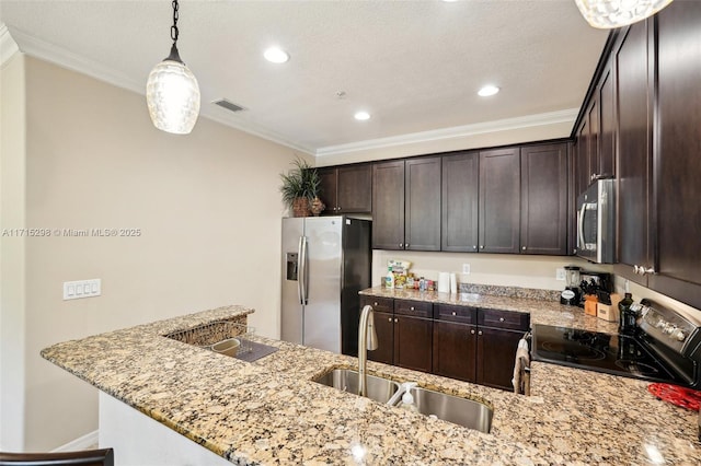 kitchen with appliances with stainless steel finishes, light stone counters, crown molding, hanging light fixtures, and dark brown cabinets