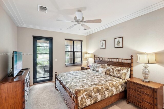 carpeted bedroom with ceiling fan, ornamental molding, and access to exterior