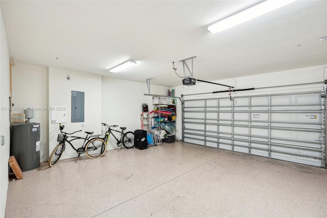 garage featuring electric panel, a garage door opener, and electric water heater