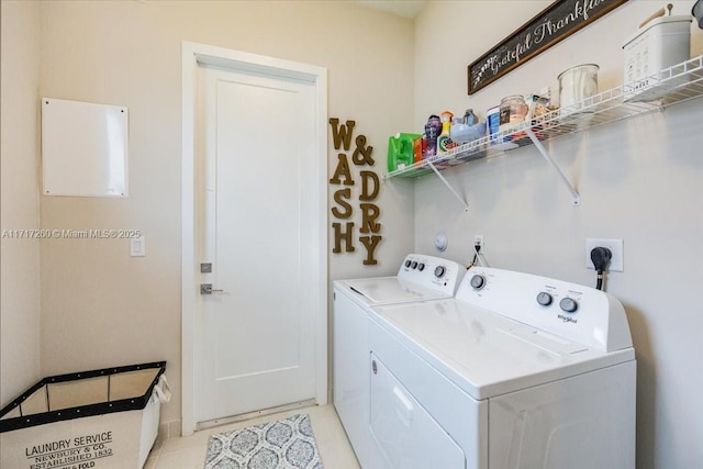 clothes washing area with washer and dryer