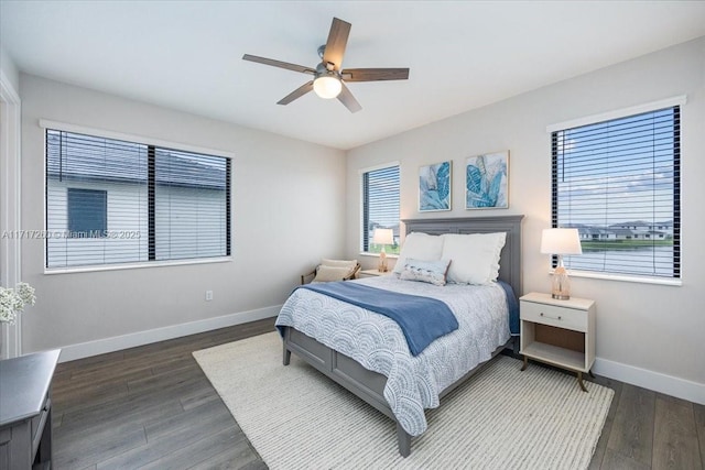 bedroom featuring ceiling fan and dark hardwood / wood-style flooring