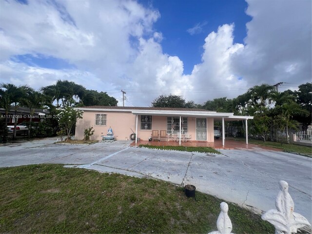 view of front of property with a carport