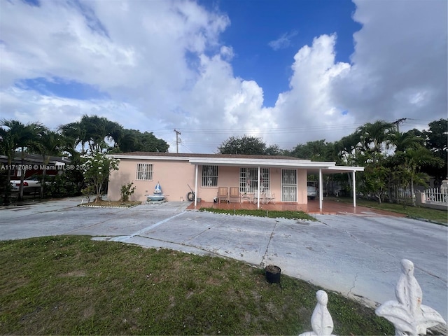 view of front of home featuring a carport