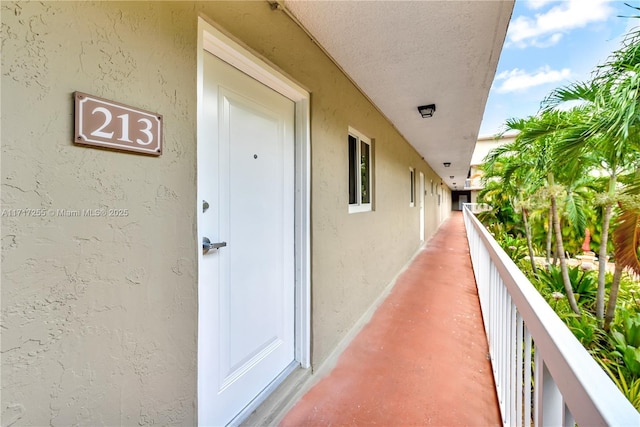 entrance to property featuring a balcony