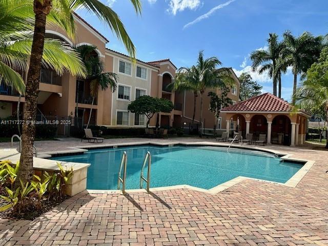 view of swimming pool featuring a patio area