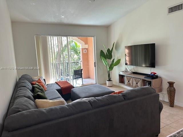 living room with light tile patterned floors