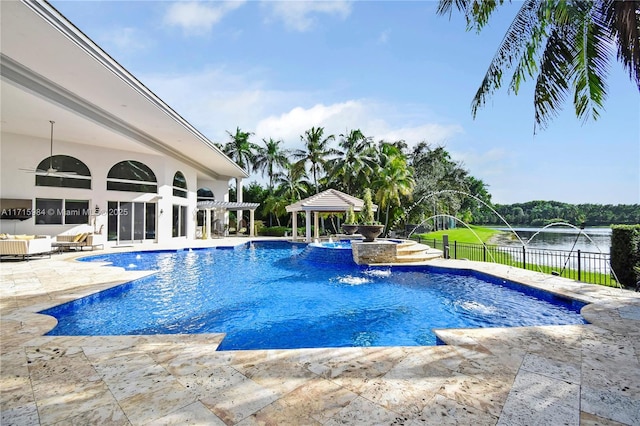 view of swimming pool featuring a water view, pool water feature, a gazebo, an in ground hot tub, and a patio