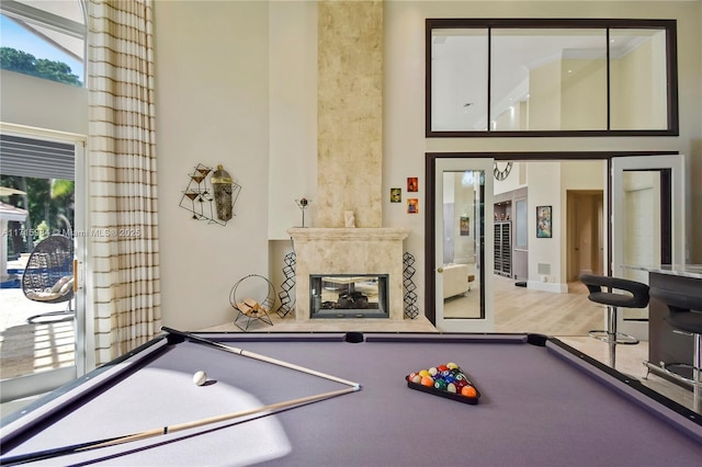 recreation room featuring a fireplace and pool table