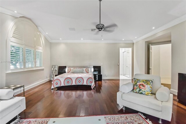 bedroom with dark hardwood / wood-style floors, ceiling fan, and crown molding