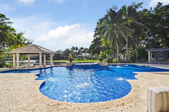 view of swimming pool with a gazebo, pool water feature, and a patio area