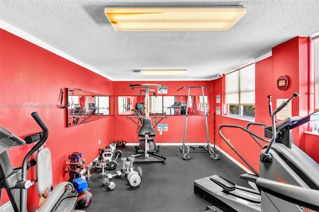 workout area with a textured ceiling