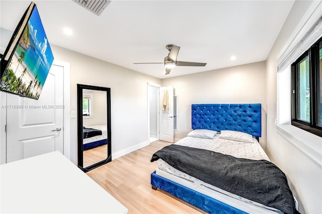 bedroom with ceiling fan and wood-type flooring