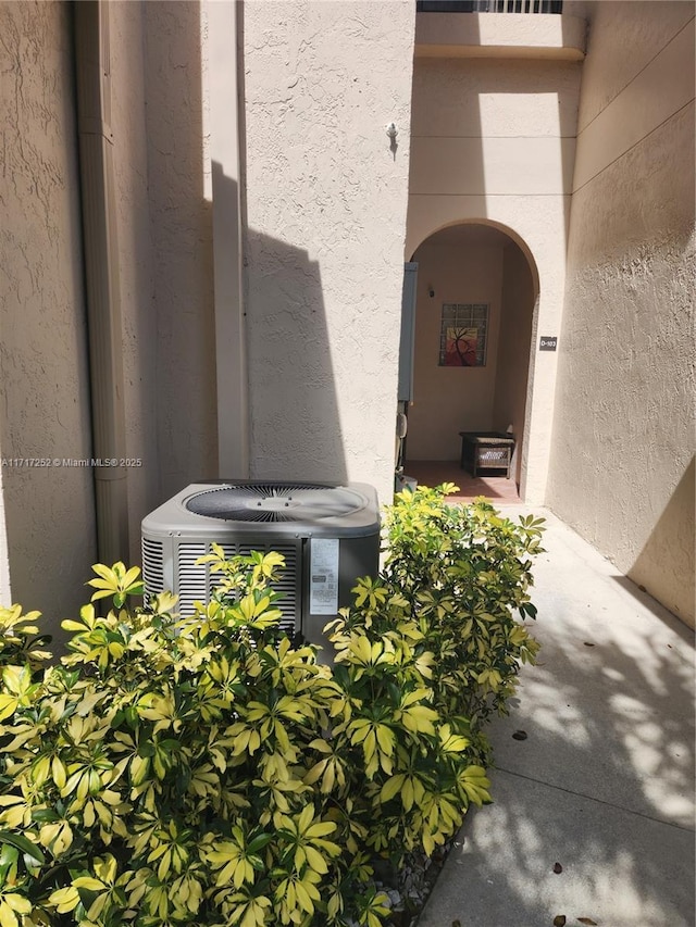 doorway to property featuring central AC