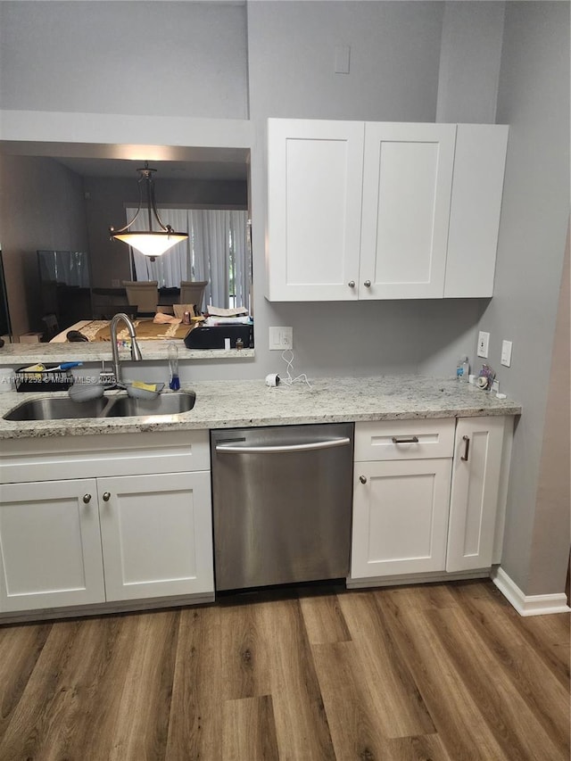 kitchen with white cabinets, dishwasher, and sink